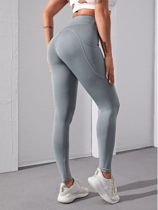 Leggings deportivos de cintura alta con bolsillo para móvil